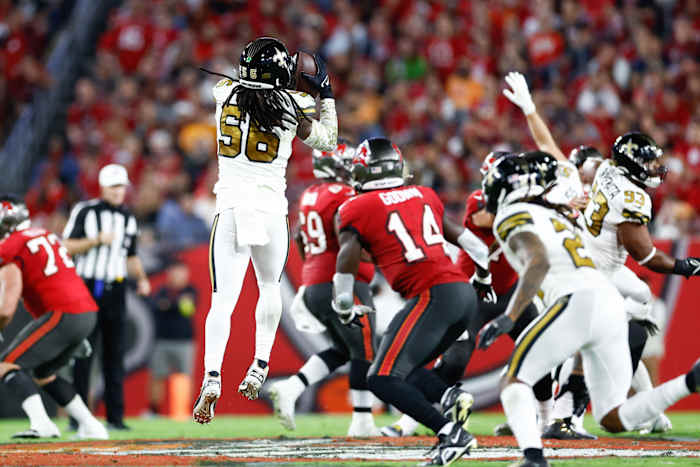 New Orleans Saints linebacker Demario Davis (56) makes an interception against the Tampa Bay Buccaneers. Mandatory Credit: Douglas DeFelice-USA TODAY Sports